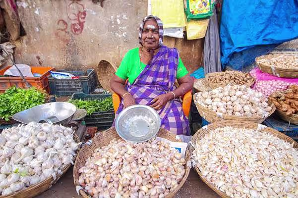 A regional vendor showcasing traditional produce, representing Swadeshi values and local community empowerment.